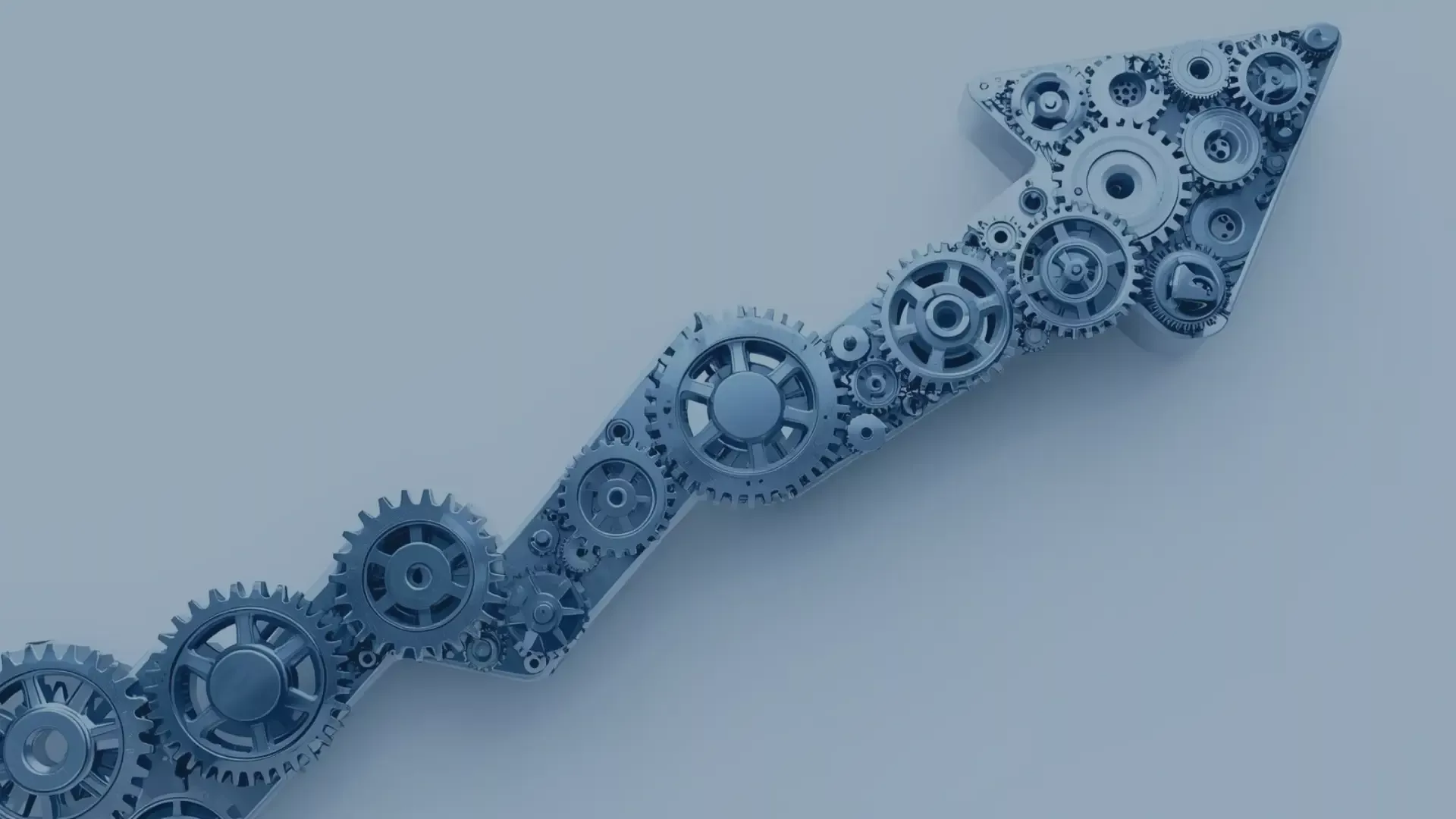 Zahnräder formen einen Wachstumspfeil – Symbol für die nahtlose Integration und Effizienzsteigerung durch Microsoft Dynamics 365 Add-ons von audius